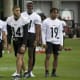 Rico Bussey works with Steelers rookies at minicamp.